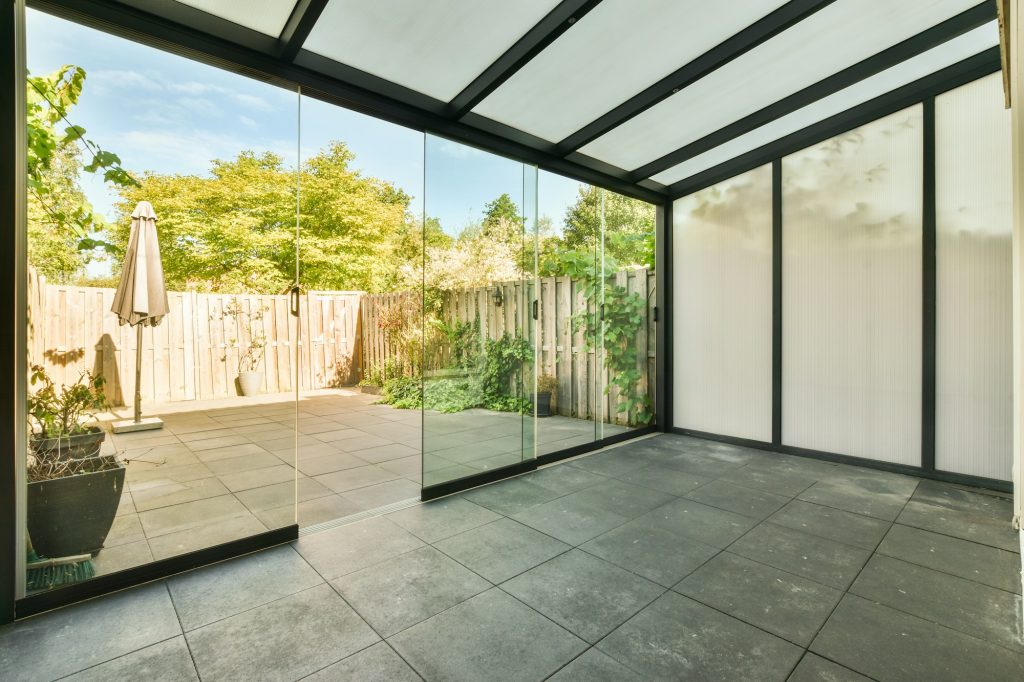 Glass wall in terrace between rooms in home